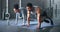 Couple, fitness and gym workout of training friends together for a core strength exercise for abs. Strong, sports and