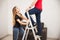 Couple fixing a lamp at home