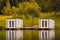 Couple of floating cabins with nice reflection on the lake water