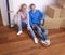 Couple on floor with boxes