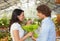 Couple in flower nursery