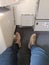 Couple of foot in airplane cabin