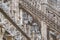 Couple framed in the gothic arches of the Duomo di Milano.