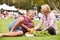 Couple With Fresh Produce Bought At Outdoor Farmers Market