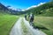 Couple of friends cyclists with mountain bikes in the mountains in beautiful landscape on the alps