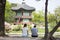 Couple front of Korean Palace, Gyeongbokgung Pavilion, Seoul, South Korea