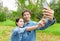 Couple fun taking self-portrait picture photos with mobile smart