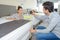 Couple in furniture store measuring bed