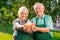 Couple of gardeners holding apples.