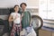 Couple Gesturing OK Posing Near Laundromat Washing Machines At Laundry