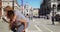 Couple of girl friends piggyback riding and taking selfies at St. Mark\'s Square