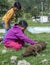 A couple of girls with a piglet outside the Otavalo animal market in Otavalo in Ecuador.