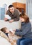 Couple giving tablets to boy