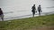 Couple,grandmother & granddaughter tourist at the beach.tide,tidal.