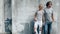 Couple in gray t-shirt over street wall