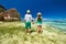 Couple in green on a beach at Seychelles