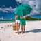 Couple in green on a beach at Seychelles