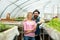 Couple in greenhouse. couple working in greenhouse. greenhouse couple workers planting flowers. family couple in