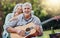 Couple, guitar and picnic with a senior man and woman in nature with a smile and music for fun. Happy, retirement and