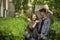 Couple guy and girl outdoors under a umbrella in the small rain.