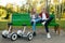 Couple with gyroboard sitting on the bench in park