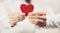 Couple hands holding Heart shape love symbol