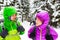 Couple happy hikers trekking in winter woods