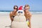 Couple having fun at beach with sandman