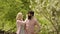 Couple having fun on field. Country life. Ecology concept. Couple take the vegetable on a sunny day in a garden. Farmer