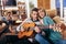 Couple having fun at home, man playing guitar, child in background