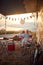 Couple having fun outdoors.Cheerful man and woman Partying Near Modern Camper Van In Camping