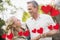 Couple having fun with red hanging hearts