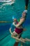 Couple having fun underwater in the pool