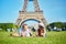 Couple having picnic near the Eiffel tower in Paris, France