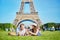 Couple having picnic near the Eiffel tower in Paris, France