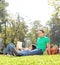 Couple having a picnic on nice sunny day in park