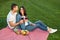 Couple having small picnic with fruits and wine