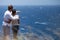 Couple in Hawaii over lookig ocean