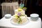 The couple held hands to cut the first piece, beautiful, wedding cake for their beloved parents