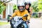Couple with helmets riding motorcycle