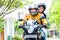 Couple with helmets riding motorcycle