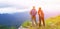 Couple hiker with backpack standing on the top of mountain with blue sky, white cloud and mist at Doi Luang Tak, Thailand