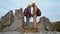 couple hikers hipsters stands on autumn landscape background with cliffs in national park Tustan, Ukraine. loving tender