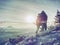 Couple of hikers look down into fogy valley. Photographer stay