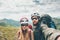 Couple hikers Man and Woman together taking selfie climbing in mountains Travel Lifestyle concept tourists wearing helmet