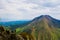 Couple of hikers on mountain slopes