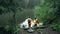 couple hikers at the rocky lake shore looking at nature beauty