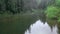 couple hikers at the rocky lake shore looking at nature beauty