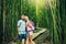 Couple hiking through bamboo forest