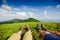 Couple in hiking boots having fun and enjoying wonderful breathtaking mountain view